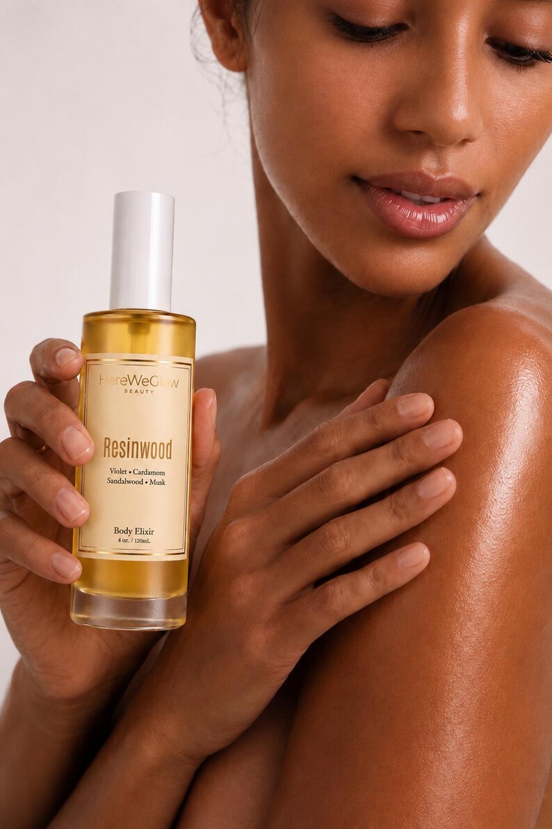 Woman applying hydrating body oil for glowing skin, non greasy woody musk perfume oil for soft radiant skin long lasting scent.