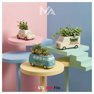 May include: Three ceramic planters shaped like vehicles, each filled with greenery. One is a cream-colored car with "Happy Trails" text, another is a teal VW bus with "Road Trips & Chill", and the third is a food truck with "Street Eats & Good Vibes".