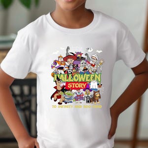 May include: A white short-sleeved t-shirt featuring a colorful graphic of various cartoon characters dressed in Halloween costumes. The text reads HALLOWEEN STORY and TO INFINITY AND BOO-YOND in yellow and red lettering centered on the chest.
