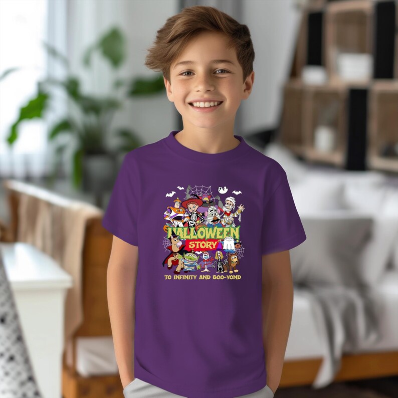 May include: A purple short-sleeved t-shirt featuring a graphic print of various animated characters in Halloween costumes. The text reads HALLOWEEN STORY and TO INFINITY AND BOO-YOND, surrounded by spiderwebs, bats, and a ghost illustration.