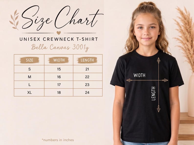 May include: A size chart for a Bella Canvas 3001y unisex crewneck t-shirt. The chart lists sizes S, M, L, and XL with corresponding width and length measurements in inches. A black t-shirt is shown with arrows indicating width and length.