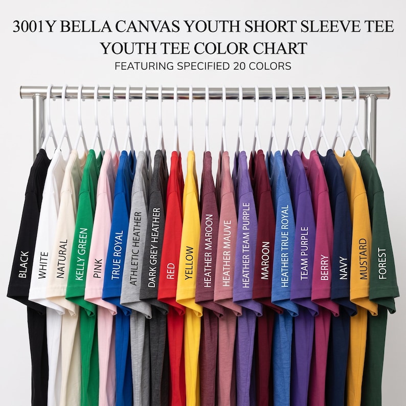 May include: A color chart for 3001Y Bella Canvas youth short sleeve tees, displaying 20 shirts on white hangers. Colors include black, white, natural, kelly green, pink, true royal, athletic heather, dark grey heather, red, yellow, maroon, mauve, purple, berry, navy, mustard, and forest.