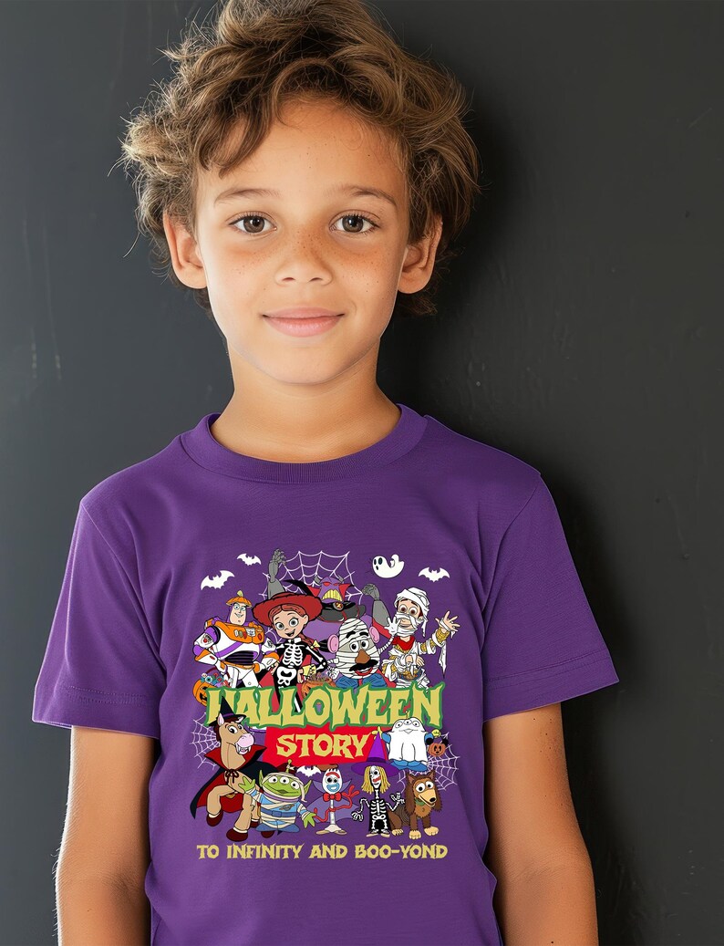 May include: A purple short-sleeved t-shirt featuring a graphic print of various animated characters dressed in Halloween costumes. The text reads "HALLOWEEN STORY" and "TO INFINITY AND BOO-YOND" in yellow and green lettering against a dark background.