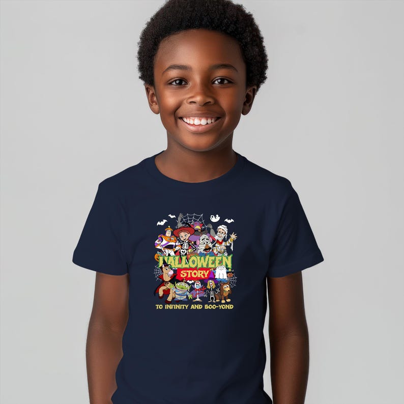 May include: A navy blue short-sleeve t-shirt featuring a colorful graphic of various animated characters in Halloween costumes. The text reads HALLOWEEN STORY and TO INFINITY AND BOO-YOND, surrounded by spiderwebs, bats, and a ghost illustration.