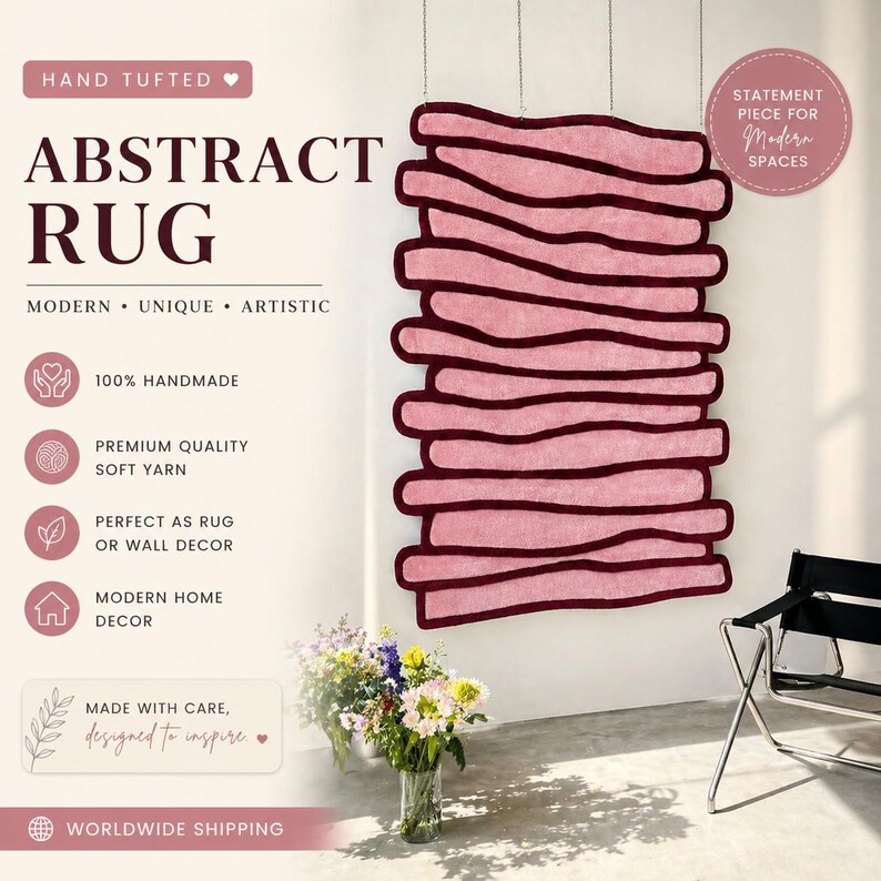 May include: A hand-tufted abstract rug in shades of pink and burgundy, designed for modern spaces. The rug is made with soft yarn and can be used as a rug or wall decor. The text on the image says "Abstract Rug" and "Modern, Unique, Artistic."