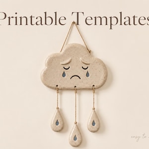 May include: A beige speckled ceramic cloud wall hanging with a sad face and three dangling teardrop-shaped pendants suspended by twine. The text "Printable Templates" appears at the top, and "easy to make" is written in the bottom right corner.