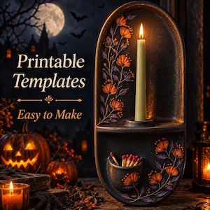 Puede incluir: Un portavelas de pared ovalado y oscuro con un recipiente para cerillas integrado, decorado con motivos florales naranjas y morados. Una vela cónica se asienta en el soporte. El texto dice: Printable Templates, Easy to Make.