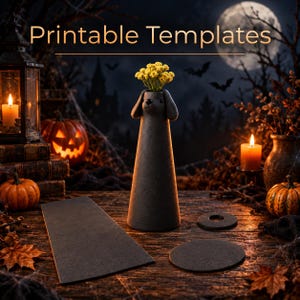 May include: A dark gray, cone-shaped vase featuring a dog head design with floppy ears, holding a small bouquet of yellow flowers. The set includes a flat rectangular piece and two circular pieces, all in a matching dark gray, matte finish.