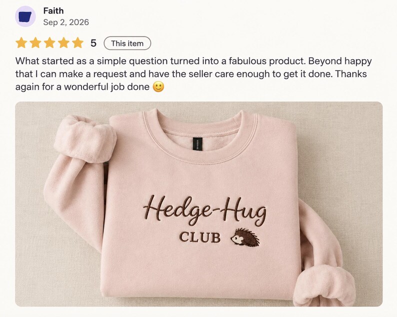 May include: A light pink crewneck sweatshirt featuring dark brown embroidery on the chest. The text reads Hedge-Hug CLUB, accompanied by a small embroidered graphic of a hedgehog. The garment has long sleeves with ribbed cuffs and a ribbed neckline.