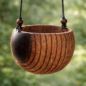 May include: A set of three ceramic mugs with a speckled, matte finish in cream, light grey, and dark grey. Each mug has a simple, minimalist design, ideal for coffee or tea.