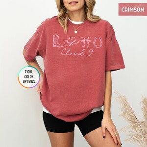 May include: A white ceramic mug with a black handle and the text "But First, Coffee" in a handwritten style. The mug is on a white surface. The mug is 4 inches tall.