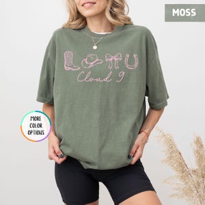 May include: A set of three ceramic mugs with a speckled, matte finish. The mugs are in shades of cream, light gray, and dark gray. Each mug has a simple, minimalist design, perfect for coffee or tea.