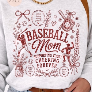 May include: A light gray sweatshirt with a baseball-themed design in red. The design includes the words "BASEBALL Mom," baseball bats, baseballs, and the phrases "Supporting Today, Cheering Forever," and "Game Day Ready."
