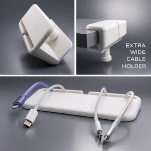 May include: A white plastic extra wide cable holder with a screw clamp. The holder is shown with various cables inserted. The text "EXTRA WIDE CABLE HOLDER" is printed on the right side of the image.
