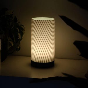 May include: A handmade, wooden cutting board with a natural finish. The rectangular board features a juice groove and a handle. Dimensions are approximately 18 inches long, 12 inches wide, and 1 inch thick.