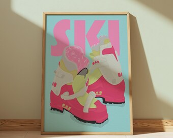 May include: A framed print featuring a pair of pink and white ski boots against a light blue background. The word "SKI" is displayed in large pink letters above the boots. The boots have yellow and black accents.