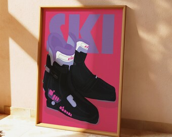 May include: A framed art print featuring a pair of black ski boots with purple and white accents against a vibrant pink background. The word "SKI" is displayed in large purple letters. The artwork has a modern, graphic style.