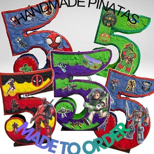 May include: Handmade piñatas in the shape of the number 5, featuring various superhero and cartoon characters. The piñatas are decorated with red, blue, green, and purple paper and include the text "MADE TO ORDER" and "HANDMADE PIÑATAS".