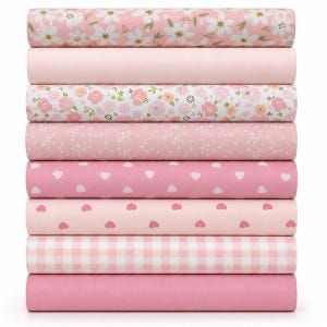 May include: A stack of nine folded fabric bolts in various shades of pink and white. The patterns include white flowers on pink, solid light pink, pink floral prints, tiny white floral patterns, white hearts on pink, pink hearts on light pink, and a pink gingham check.