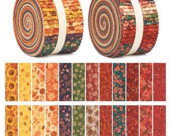 May include: Two rolls of fabric strips, each secured with a white paper band, featuring a variety of patterns including sunflowers, autumn leaves, acorns, pinecones, and paisley prints in shades of orange, yellow, red, green, and brown.