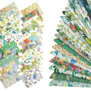 May include: A collection of rectangular fabric swatches featuring various botanical and floral patterns in shades of green, yellow, orange, pink, and blue. The fabrics are arranged in a scattered layout on the left and a fan-like stack on the right.