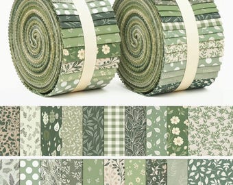 May include: Two rolls of fabric strips, known as jelly rolls, featuring a variety of green and cream patterns. The designs include floral prints, polka dots, gingham checks, and botanical leaf motifs, all secured with a white paper band.