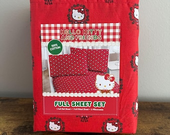 Novo Jogo de Lençóis de Natal Hello Kitty HK Sanrio com Guirlanda de Azevinho Vermelho - Coleção 2025