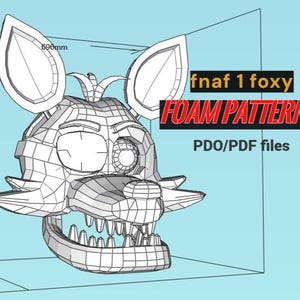 Può includere: Modello wireframe di una testa di volpe con bocca aperta e denti affilati. Il modello è etichettato "fnaf 1 foxy FOAM PATTERNS PDO/PDF files". La testa misura 69 cm di larghezza.