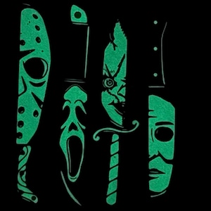 May include: A black graphic design featuring six green, stylized images of horror movie characters and weapons. The images include a hockey mask, knives, and a Scream mask.
