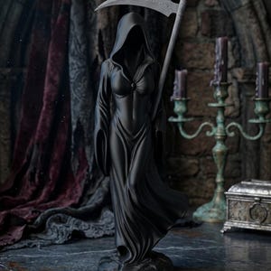 May include: A matte black figurine of a hooded figure wearing a long, flowing robe and holding a large scythe. The figure has a concealed face within the hood and stands on a textured base, depicted in a dark, atmospheric setting with sharp details.