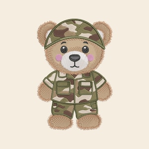 May include: An embroidered teddy bear design featuring a light brown bear wearing a camouflage print cap, a matching camouflage button-down shirt with two front pockets, and camouflage shorts. The bear has pink cheeks and a white muzzle.
