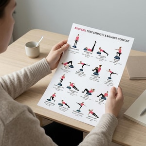 May include: A printed workout guide titled "BOSU BALL CORE STRENGTH & BALANCE WORKOUT" featuring illustrated exercises. The guide includes instructions for balance holds, squats, and other core exercises. The person is holding the guide.