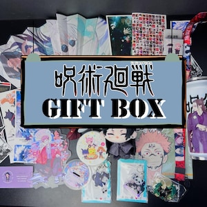 May include: A Jujutsu Kaisen gift box set featuring a variety of anime-themed merchandise including a folding fan, acrylic stands, a plush doll, keychains, a lanyard, a tumbler, and printed cards with character illustrations and Japanese text.