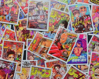 May include: A collection of colorful Japanese manga magazine covers. The covers feature various anime characters and Japanese text. The magazines are in various sizes and orientations, creating a visually dynamic arrangement.