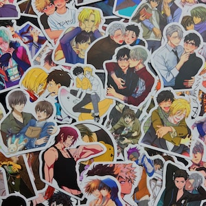 May include: A collection of anime-style stickers featuring various male characters in different poses and pairings. The stickers showcase a range of colors, including blues, yellows, and browns, with detailed facial expressions and clothing.