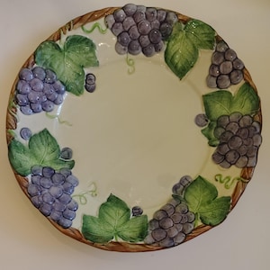 May include: A set of three ceramic mugs with a speckled, matte finish. The mugs are in shades of cream, light gray, and dark gray. Each mug has a simple, minimalist design, perfect for coffee or tea.