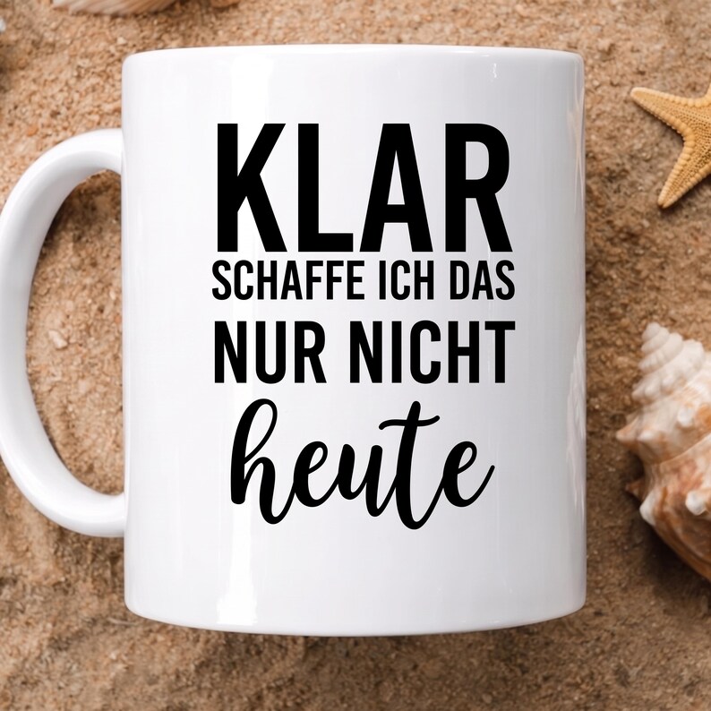 May include: A white ceramic mug featuring the black printed text KLAR SCHAFFE ICH DAS NUR NICHT heute. The mug has a smooth cylindrical body with a curved handle on the left side, designed for holding hot or cold beverages in a standard capacity.