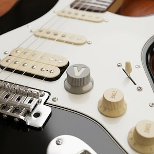 V-Buck Guitar Volume Knob – Strat Style, Textured Polymer, Knurled Grip, White 'V' Inlay