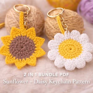 May include: Two crochet flower keychains, one a sunflower with yellow petals and a brown center, the other a daisy with white petals and a yellow center. Both have gold key rings and are set against a backdrop of yarn and the text "2 IN 1 BUNDLE PDF Sunflower + Daisy Keychain Pattern."
