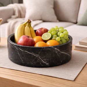 Natural black marble fruit bowl close up stone texture