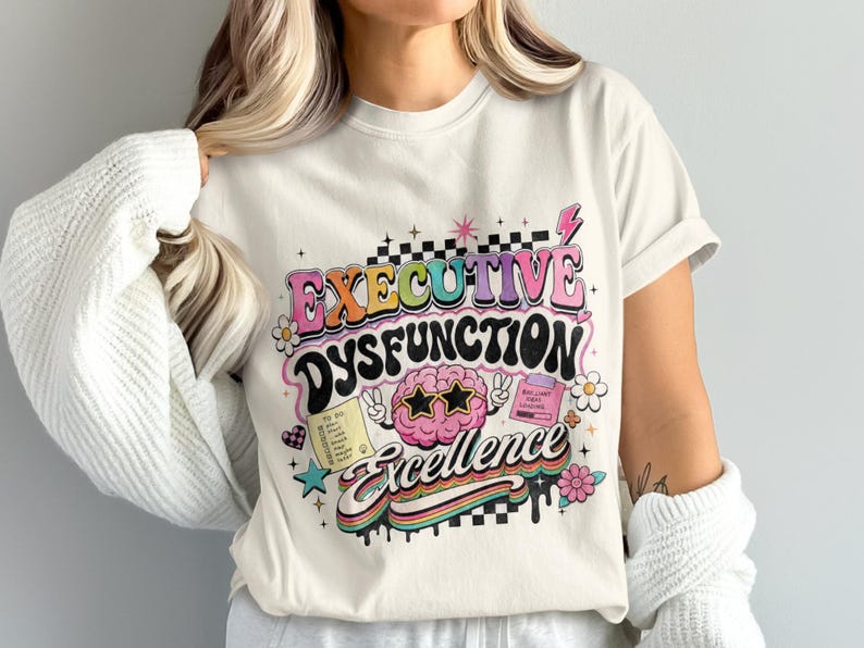 Cream t-shirt with "Executive Dysfunction Excellence" graphic featuring a brain and checklist.