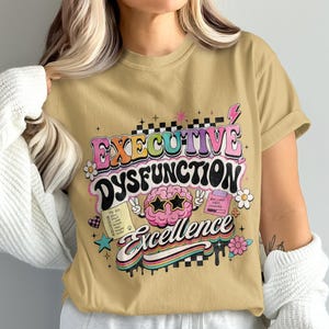 T-shirt with "Executive Dysfunction Excellence" in colorful text and graphic elements.