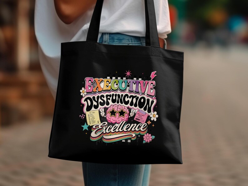 Black tote bag with "Executive Dysfunction Excellence" and to-do list.