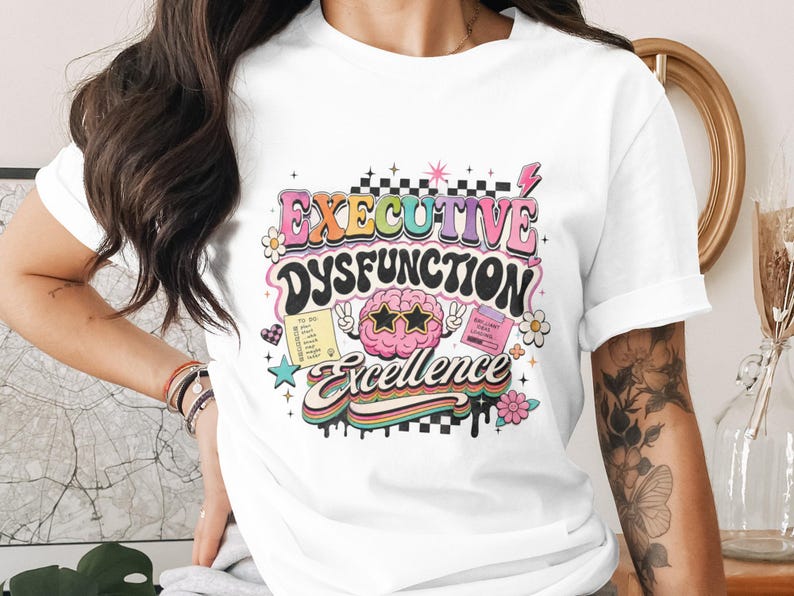 T-shirt with "Executive Dysfunction Excellence" text, sunglasses, and to-do list.
