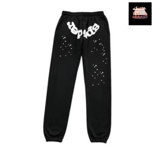 May include: Black sweatpants with white text that reads "spider" across the top. White star-like designs are scattered down the legs. The sweatpants have a drawstring waist and elastic cuffs.