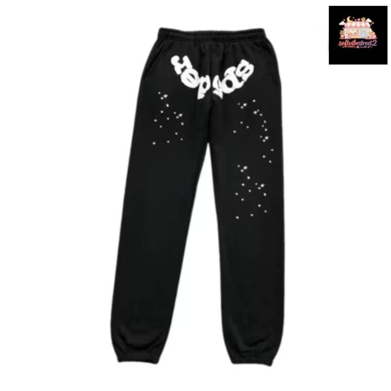 May include: Black sweatpants with white text that reads "spider" across the top. White star-like designs are scattered down the legs. The sweatpants have a drawstring waist and elastic cuffs.