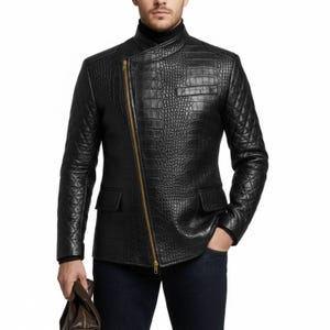 May include: Black leather jacket with a crocodile skin effect, featuring a diagonal gold zip, two pockets, and quilted shoulder and arm panels. The jacket has a high collar and a tailored fit.