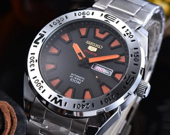 Seiko Style Watch Black Dial Orange Accents Sport Design