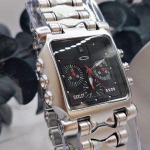 A Minute Machine-style chronograph: a square case in black steel a bold symbol of the era