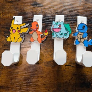 Pokemon pikachu Squirtle Charmander bulbasaur charisard blastoise wall door hook Loungefly bag display home decor games room gamer